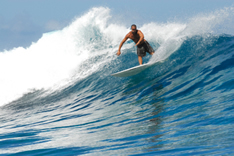 photo shows positive image of a surfer - surfing life's trials and tribulations such as redundancy